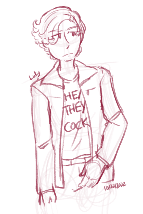 Ankh wearing a shirt that says He They Cock