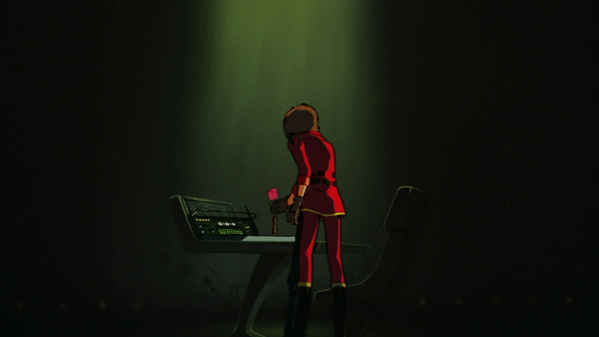 Harlock picking up the rose from Maya's radio desk as a light shines on him from above.
